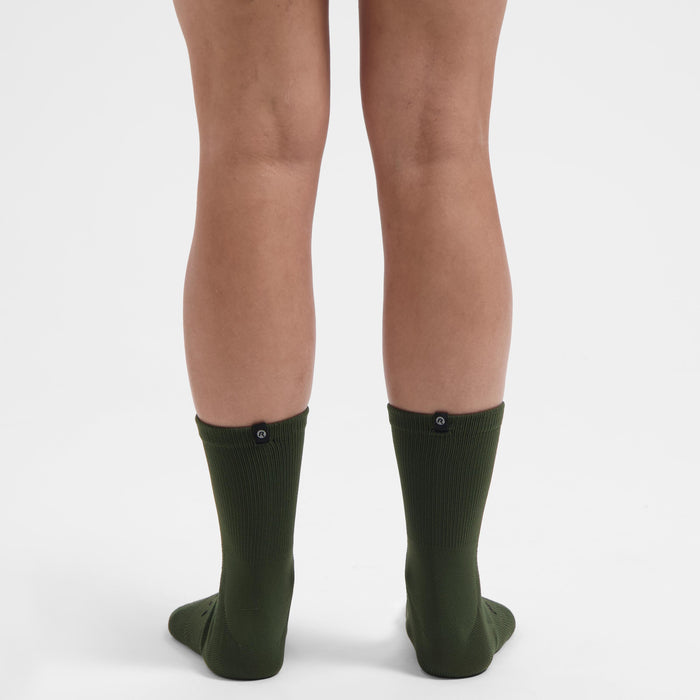 Rogelli Essential fietssokken dames groen gedragen achterkant.