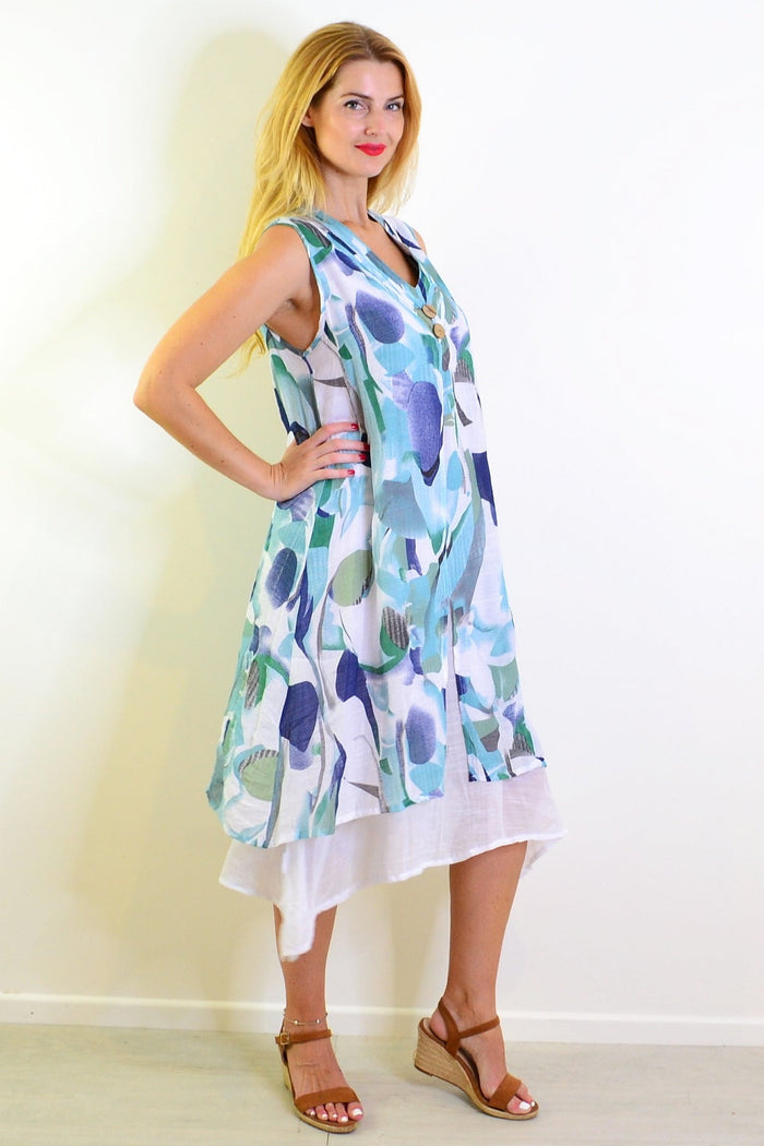 Abstract aqua tones sleeveless tunic dress by Indigo Designs, showcasing a flowing, artistic pattern on lightweight fabric.