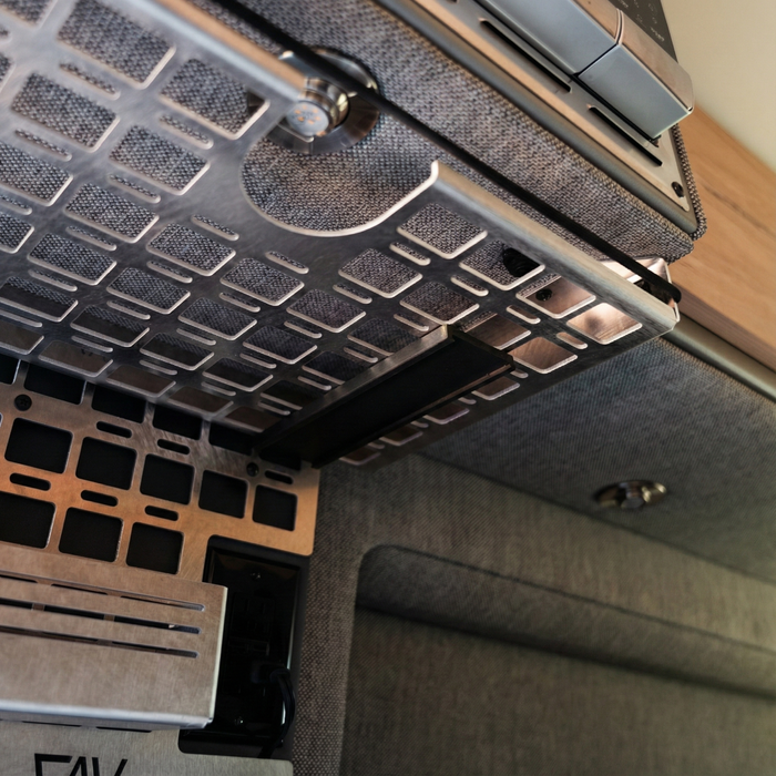Mounted Canyon Keurig Holder by CAV installed beneath cabinet in van kitchen.