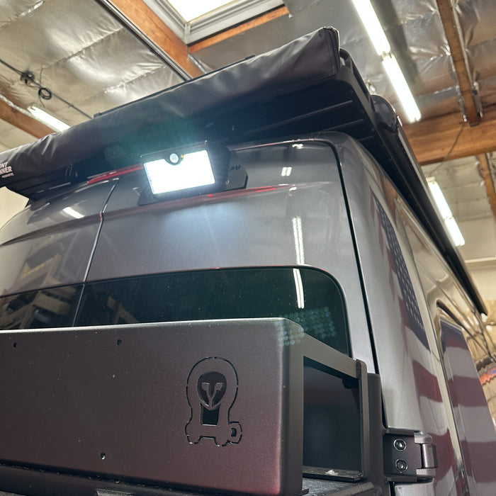 Canyon Motion Sensor Solar Light mounted on rear roof rack of a Revel van in a garage setting