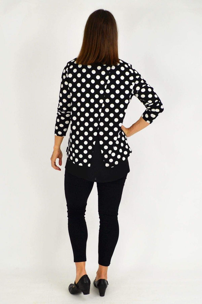 Stylius Jillian Spot Tunic Top featuring black and white spotted pattern, lightweight fabric, and relaxed fit.