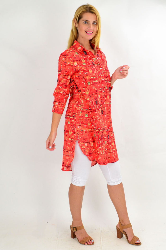 Long orange abstract tunic shirt by Ruby Rain, featuring a flowing design and vibrant color, perfect for summer wear.