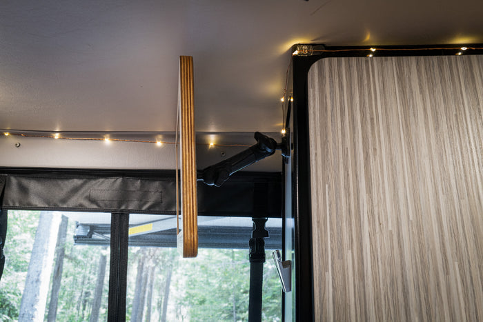 Revel Mount Anywhere 20mm ball with metal mounting plate installed on van ceiling near cabinet