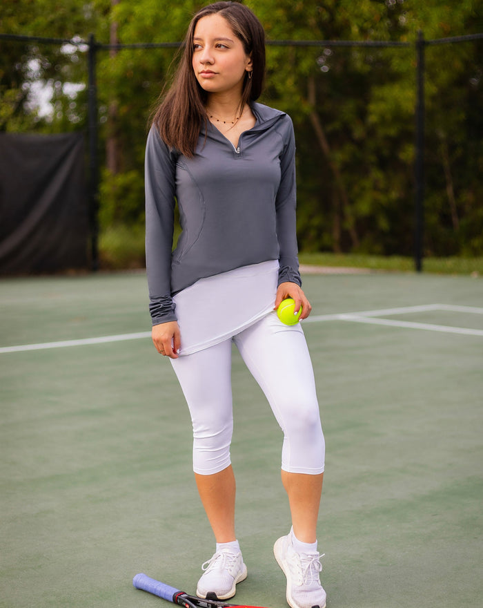 Women wearing smoke mock zip long sleeve top on a tennis court. (Style 3001) - BloqUV