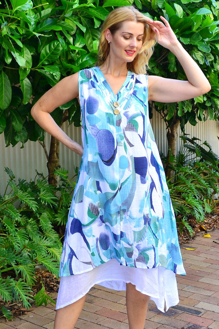 Abstract aqua-toned sleeveless tunic dress by Indigo Designs, featuring a flowing silhouette and vibrant pattern.