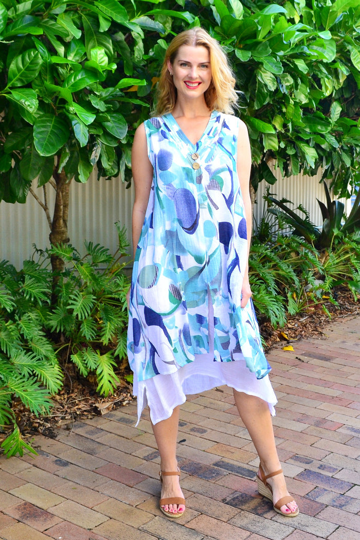 Abstract aqua tones sleeveless tunic dress by Indigo Designs, featuring a flowing fabric and modern design, shown on a model.