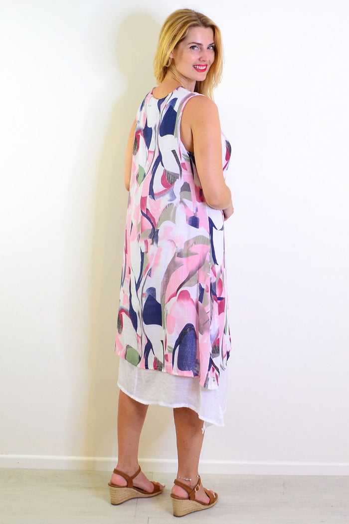 Abstract pink-toned sleeveless tunic dress by Indigo Designs, featuring a flowing fabric and vibrant design.