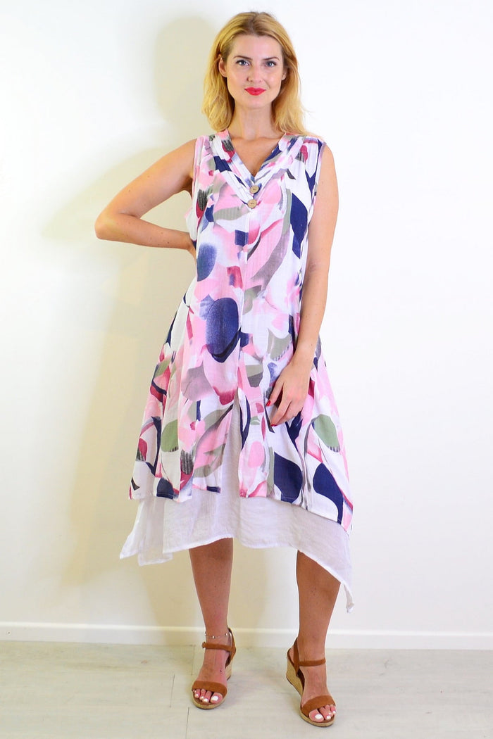 Abstract pink-toned sleeveless tunic dress by Indigo Designs, featuring a flowing silhouette and vibrant artistic patterns.