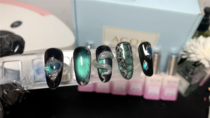 Bold emerald at eye look with magnetic light effects, snake-inspired detailing and textured scale are.