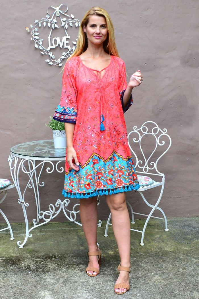 Coral and aqua Orientique Bagatelle 3/4 sleeve tunic dress with floral pattern, lightweight summer fashion for women.