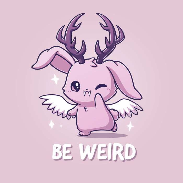 Classic Cotton T-shirt_TeeTurtle light pink Be Weird apparel featuring a winking wolpertinger. Caption says, "be weird".