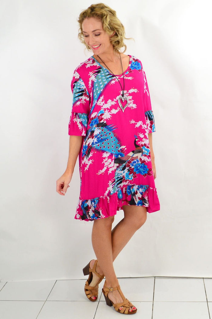 Pink peacock print Freez tunic dress with 3/4 sleeves, featuring vibrant colors and elegant design.