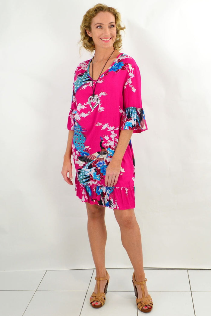 Pink peacock print tunic dress with 3/4 sleeves by Freez, showcasing elegant floral and peacock details on soft fabric.