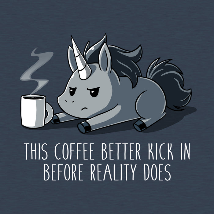 Premium Cotton T-shirt_Teeturtle denim blue Before Reality Kicks In apparel featuring a grumpy-looking unicorn on its stomach with a cup of steaming coffee in front of it. Caption reads 'This coffee better kick in before reality does".
