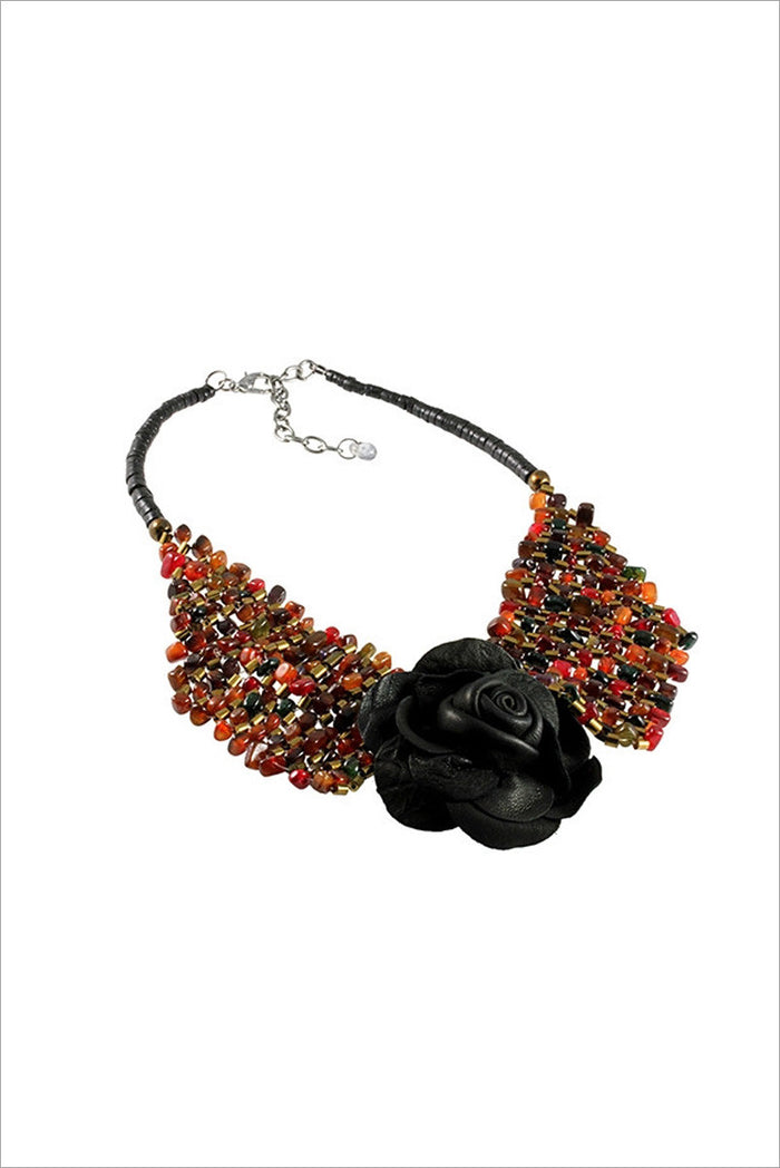 Black leather rose necklace with silver accents, stylish jewelry piece by I Love Tunics featuring a detailed rose pendant.