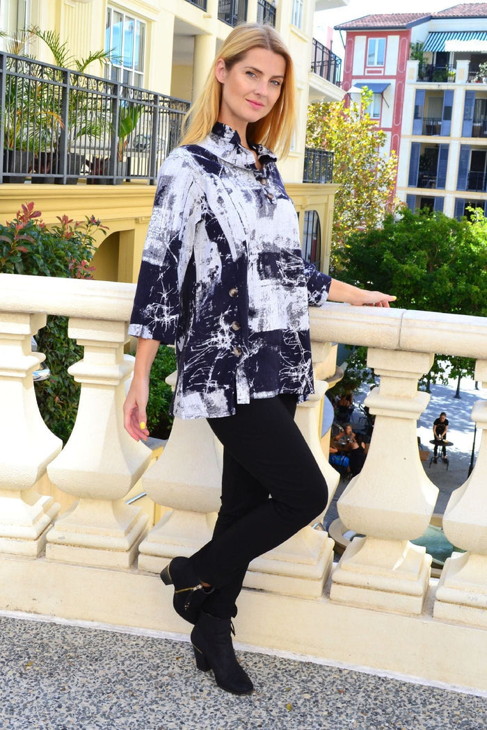Black and white high collar tunic shirt by Ruby Rain, showcasing a stylish long-sleeve tunic with a high neckline and tailored fit.
