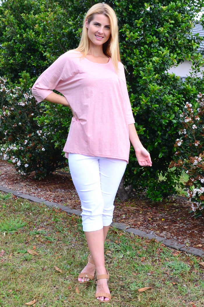 Stylish Stylius blush sloping sleeve tunic top displayed on a model showing the relaxed fit and elegant sleeve design.