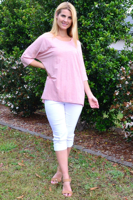 Stylish Stylius blush sloping sleeve tunic top displayed on a model showing the relaxed fit and elegant sleeve design.