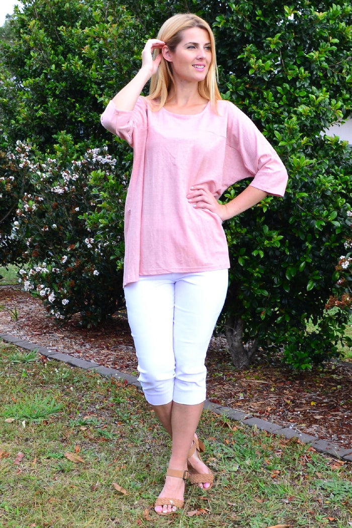 Stylius blush sloping sleeve tunic top displayed on a hanger with a relaxed fit and elegant design.