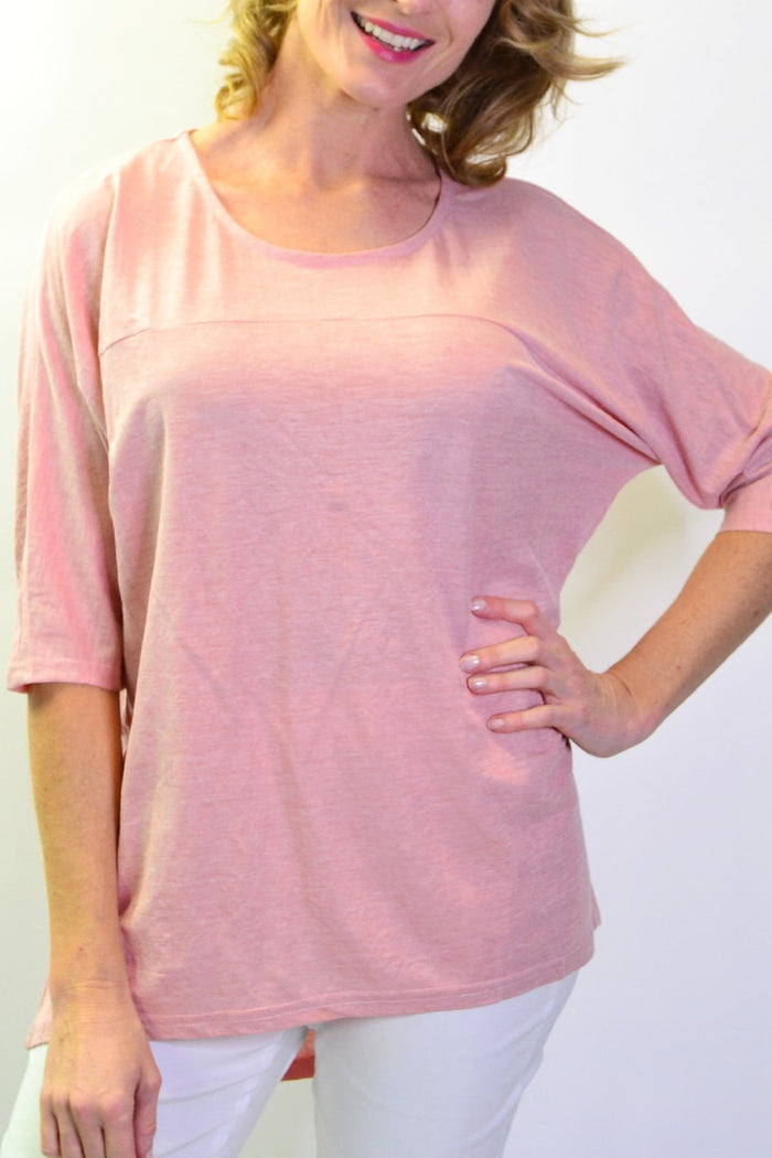 Stylius blush sloping sleeve tunic top with a relaxed fit, shown on a model, featuring stylish sloped sleeves and soft fabric.