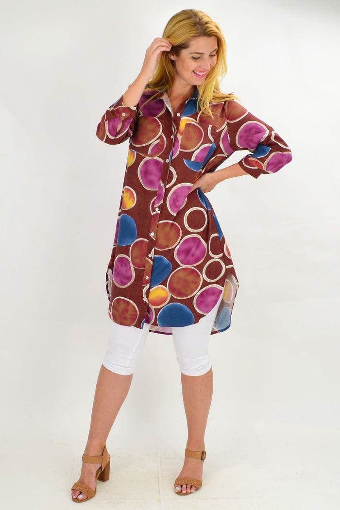 Brown colourful circles tunic shirt by Ruby Rain, featuring a relaxed fit with vibrant circular patterns and long sleeves.