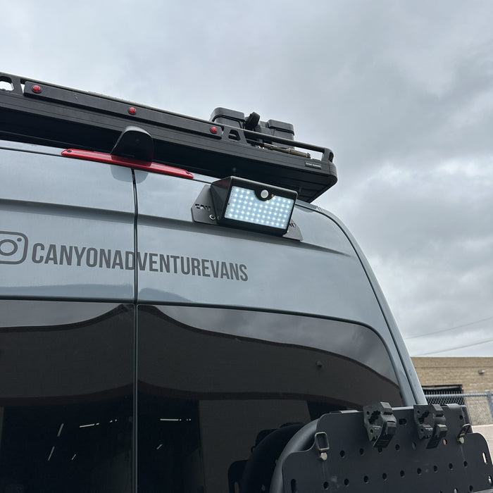 Canyon Motion Sensor Solar Light mounted on rear of van under cloudy sky
