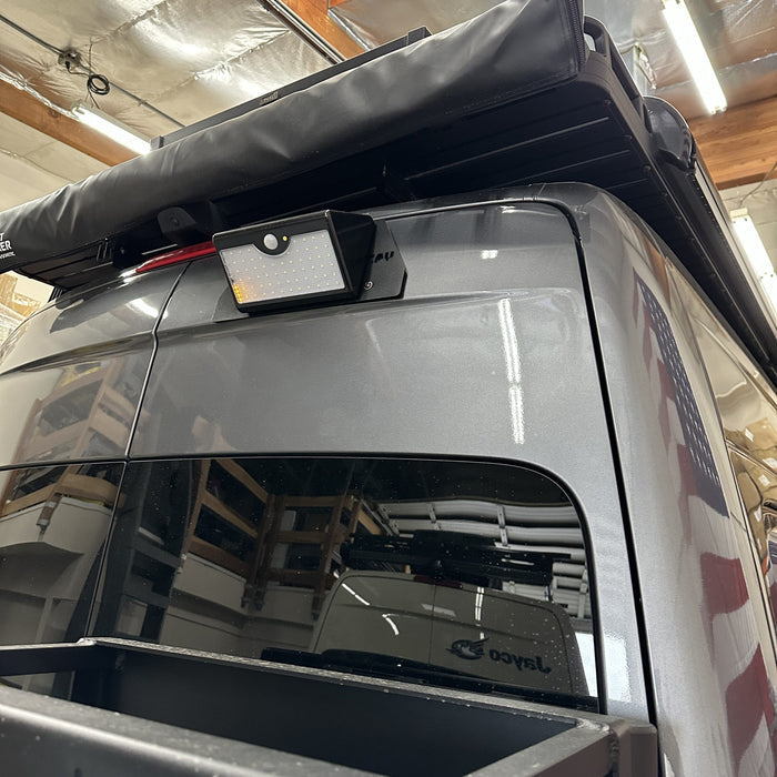 Canyon Motion Sensor Solar Light mounted on rear of Jayco van under roof rack.