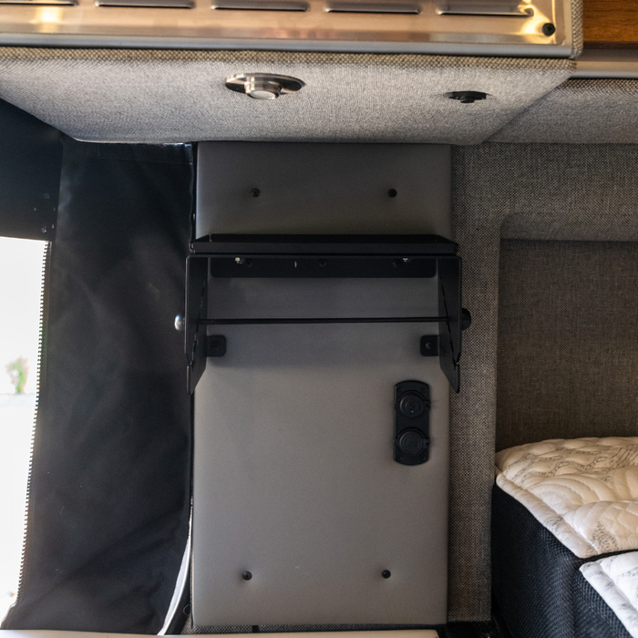 Canyon paper towel holder mounted inside van next to bed and USB outlets