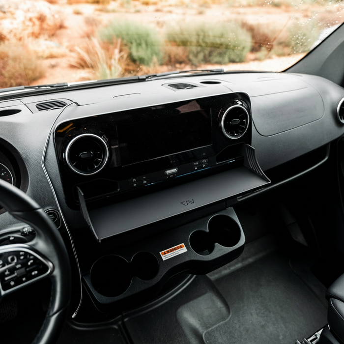 CAV D-ash Tray installed on van dashboard shelf with cup holders and center console visible