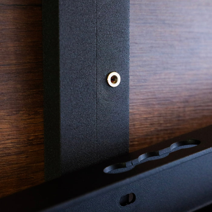 Close-up of the Legless Bed Support System 2.0 mounted on a wood van interior wall.