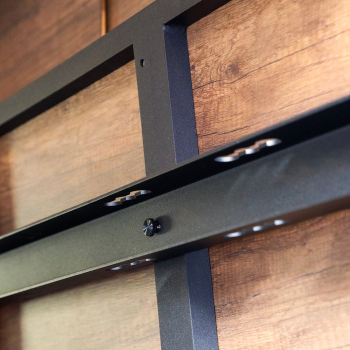 Close-up of Legless Bed Support System 2.0 by Storyteller Overland mounted in a van interior