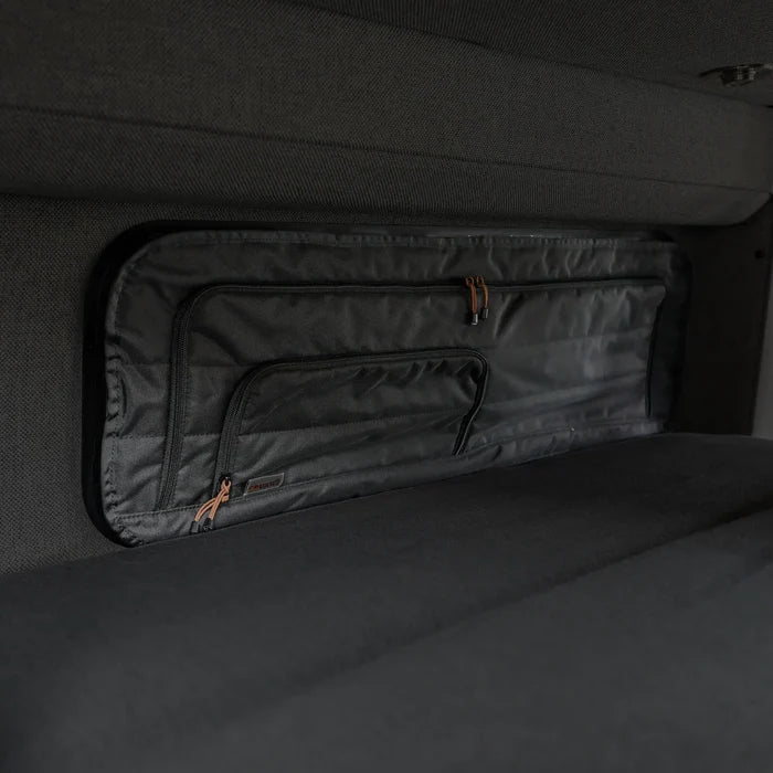 CLIMA-SHADE insulated bunk window cover installed in a van interior with dark gray upholstery.