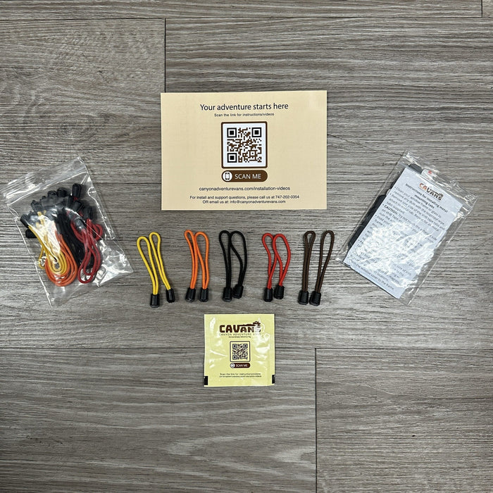 CAVAR bungee cord kit with assorted color loops, QR card, and instruction sheet on wood floor