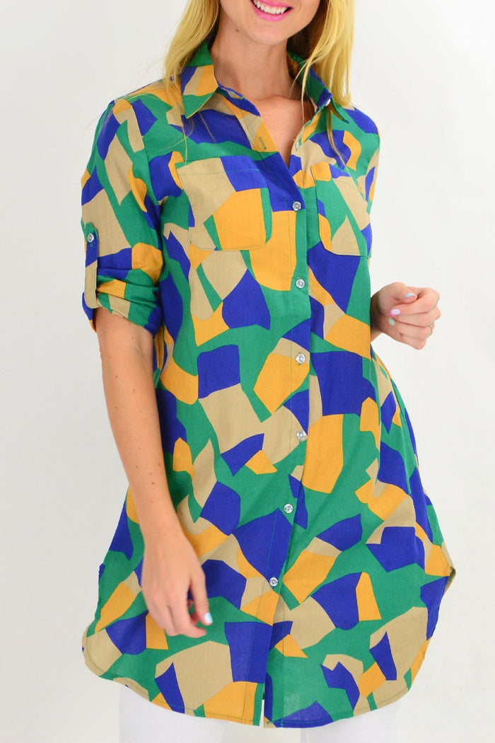 Colorful summer tunic shirt by Ruby Rain featuring vibrant patterns and a relaxed fit, displayed on a hanger.