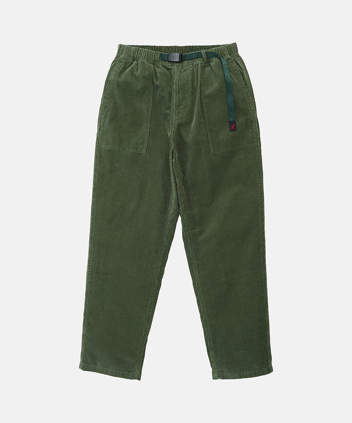 Toned olive colored Gramicci Corduroy Loose Tapered Ridge Pants with a belt against a light-tone background.