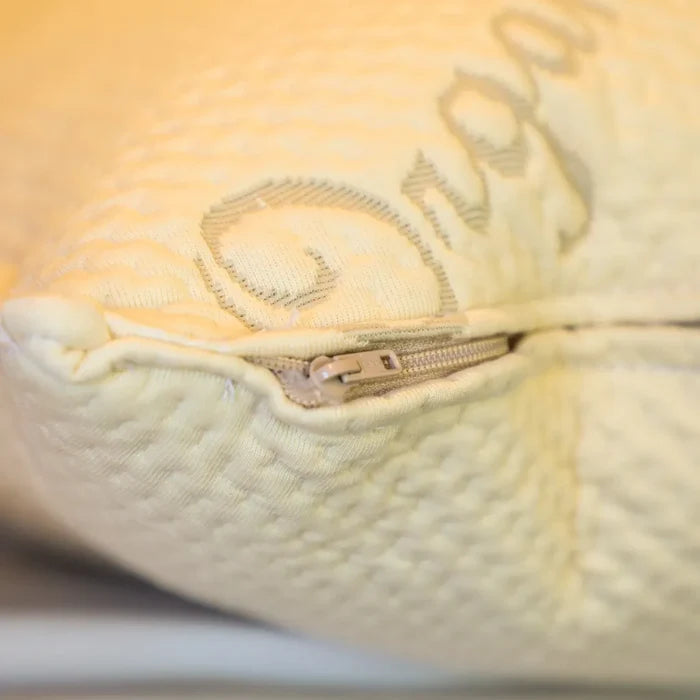 Close-up of Dream Collection adjustable pillow with visible zipper and textured fabric