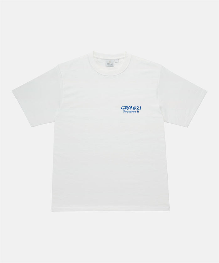 Gramicci sage pigment colored Earth Tee with blue graphic against a light-tone background.