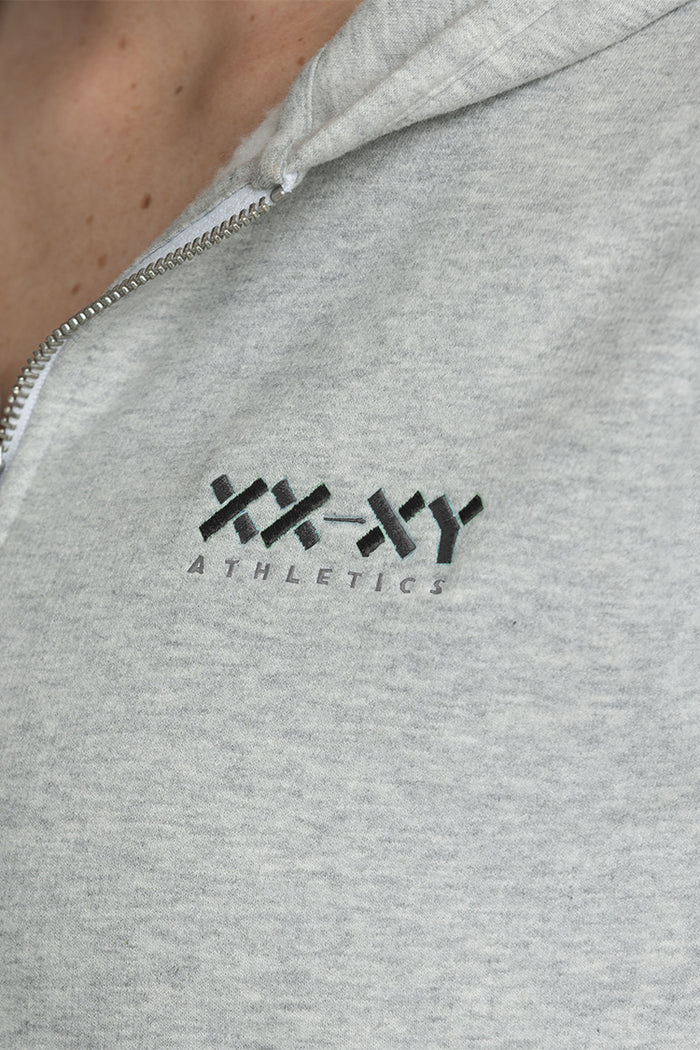 Gray hoodie with 'XXY Athletics' logo on a close-up of the chest area. || Light Heather Gray