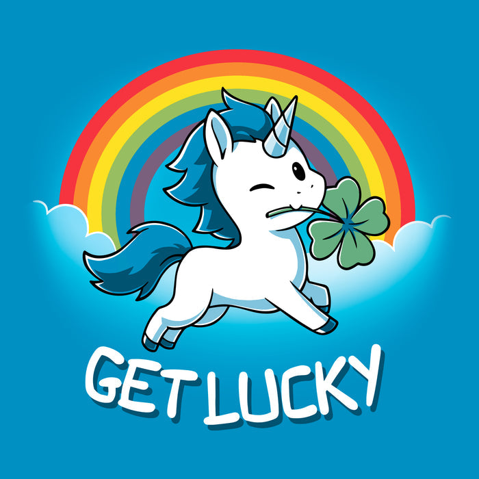 Classic Cotton T-shirt_Teeturtle sapphire blue Get Lucky apparel featuring a winking white unicorn holding a four-leaf clover while jumping through the clouds with a rainbow behind it. Caption reads, "get lucky".