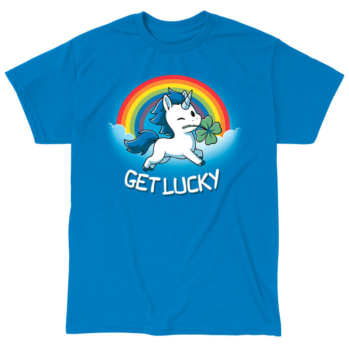 Classic Cotton T-shirt_Teeturtle sapphire blue Get Lucky apparel featuring a winking white unicorn holding a four-leaf clover while jumping through the clouds with a rainbow behind it. Caption reads, "get lucky".