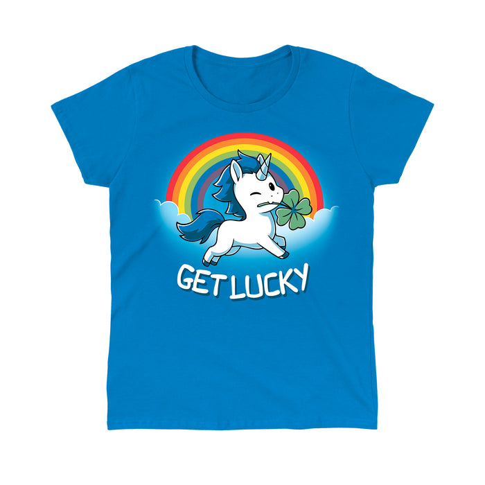 Classic Cotton T-shirt_Teeturtle sapphire blue Get Lucky apparel featuring a winking white unicorn holding a four-leaf clover while jumping through the clouds with a rainbow behind it. Caption reads, "get lucky".