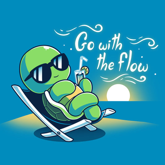 Premium Cotton T-shirt_Teeturtle cobalt blue Go with the Flow apparel featuring a turtle lounging on a beach chair with a tropical drink and sunglasses as the sun sets in the distance with the words 'Go with the Flow' to one side.