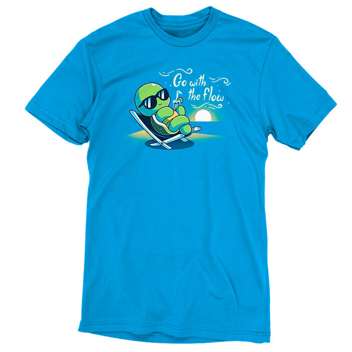 Premium Cotton T-shirt_Teeturtle cobalt blue Go with the Flow apparel featuring a turtle lounging on a beach chair with a tropical drink and sunglasses as the sun sets in the distance with the words 'Go with the Flow' to one side.