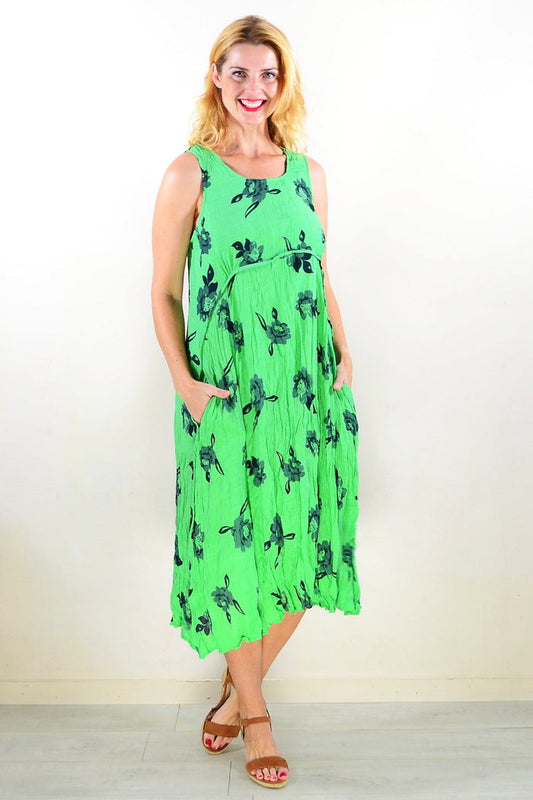 Green sleeveless tunic dress by Willow Tree, casual style with flowing fabric and simple neckline, displayed on a mannequin.