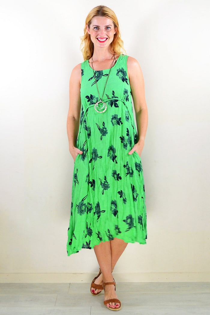 Green sleeveless tunic dress by Willow Tree with a flowing fit and simple design, shown on a model.