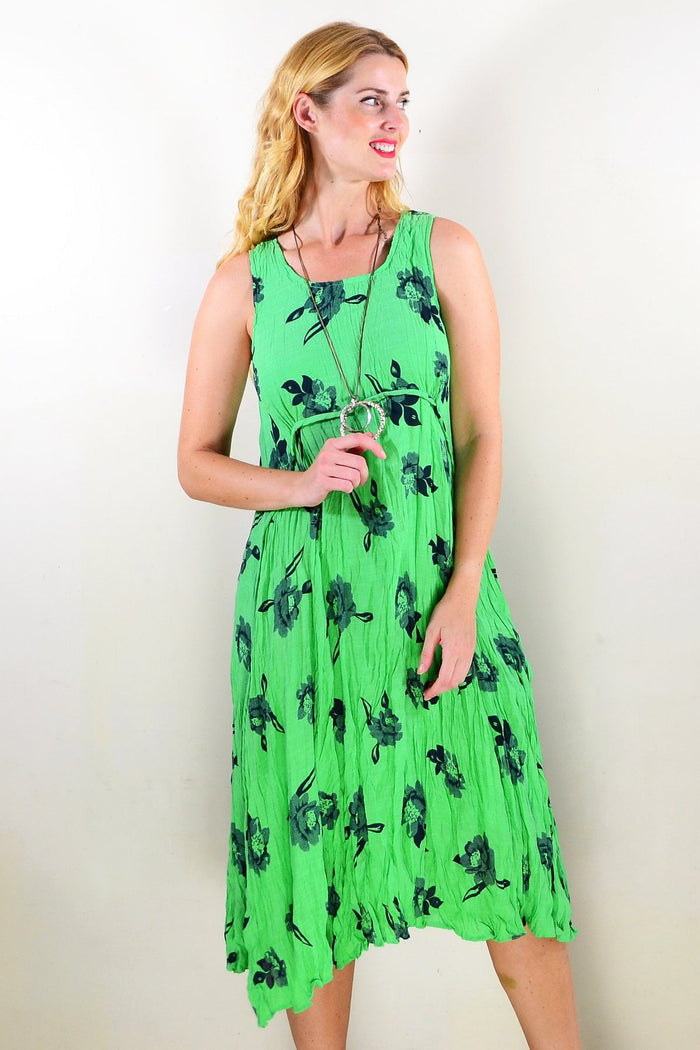 Green sleeveless tunic dress by Willow Tree, featuring a relaxed fit and simple round neckline, displayed on a hanger.