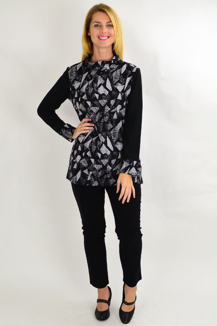 Gray abstract print tunic top by Whispers, featuring a relaxed fit and stylish design, displayed on a hanger.