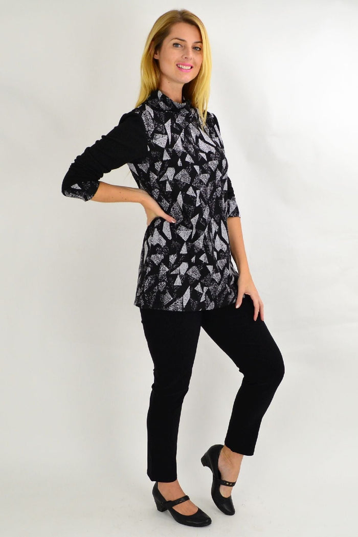 Grey smart abstract tunic top from Whispers, featuring a modern design and comfortable fit, shown on a hanger.