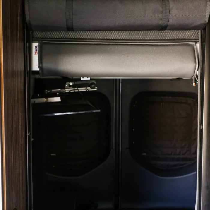 Revel van interior showing rear doors with padded insulation and overhead storage compartment