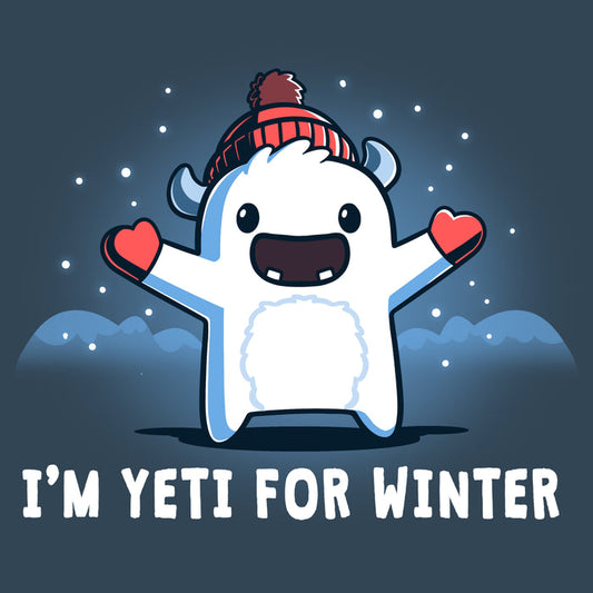 Premium Cotton T-shirt_Teeturtle denim  blue I'm Yeti for Winter apparel featuring a happy Yeti in the snowy winter mountains wearing a pom-pom winter hat and mittens. Caption reads "I'm yeti for winter".